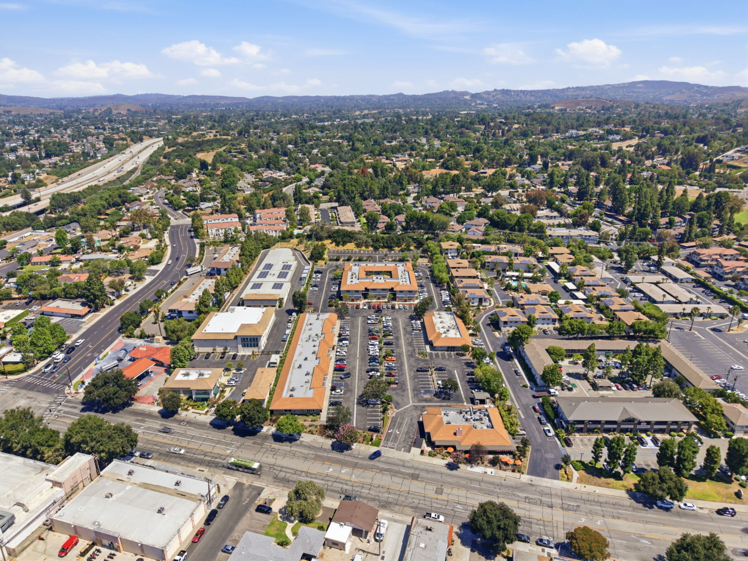 Wider aerial view showing Thousand Oaks corridor and hills
